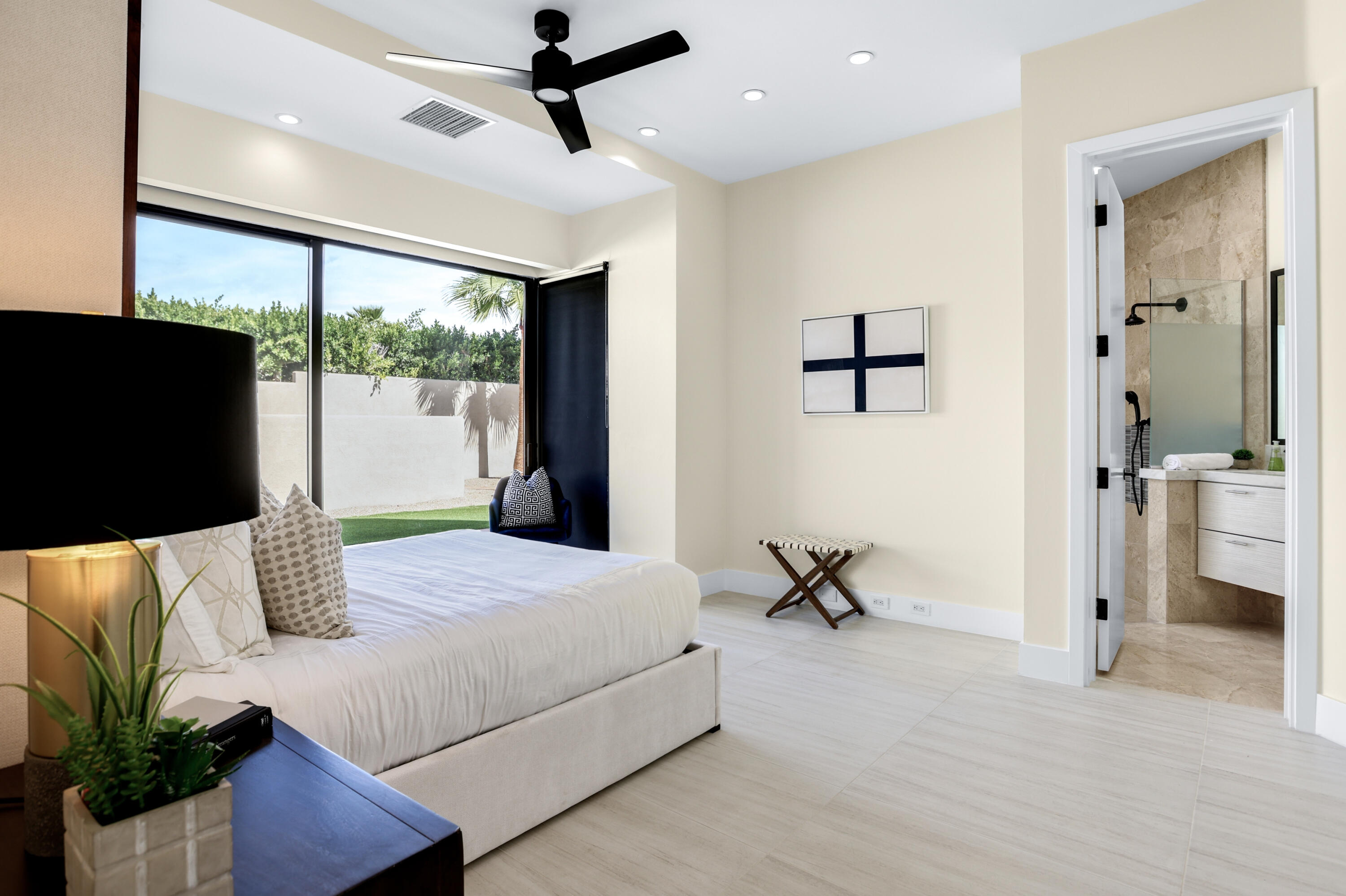 1 Seclude Court Rancho Mirage, CA 92270 - Photo 32 of 52 a bedroom with a bed and a flat screen tv