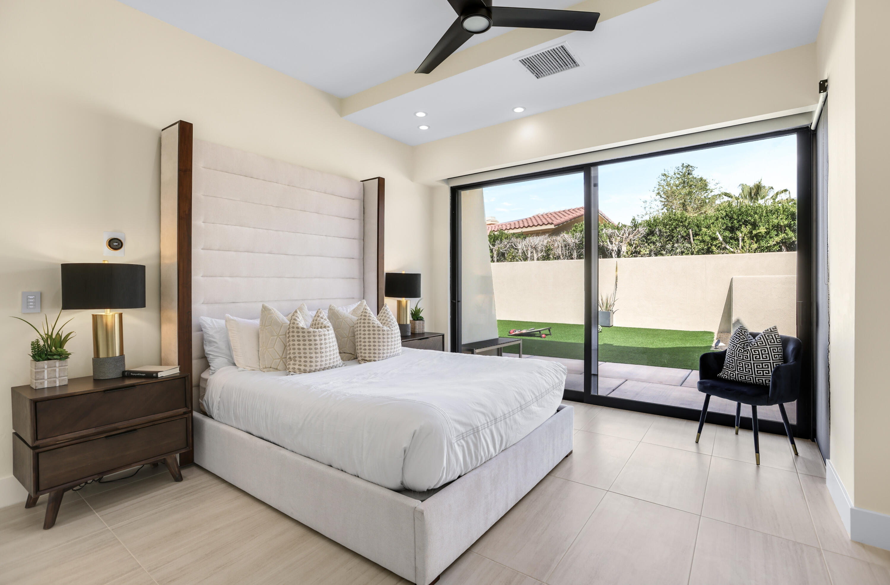 1 Seclude Court Rancho Mirage, CA 92270 - Photo 33 of 52 a bedroom with a bed and large window