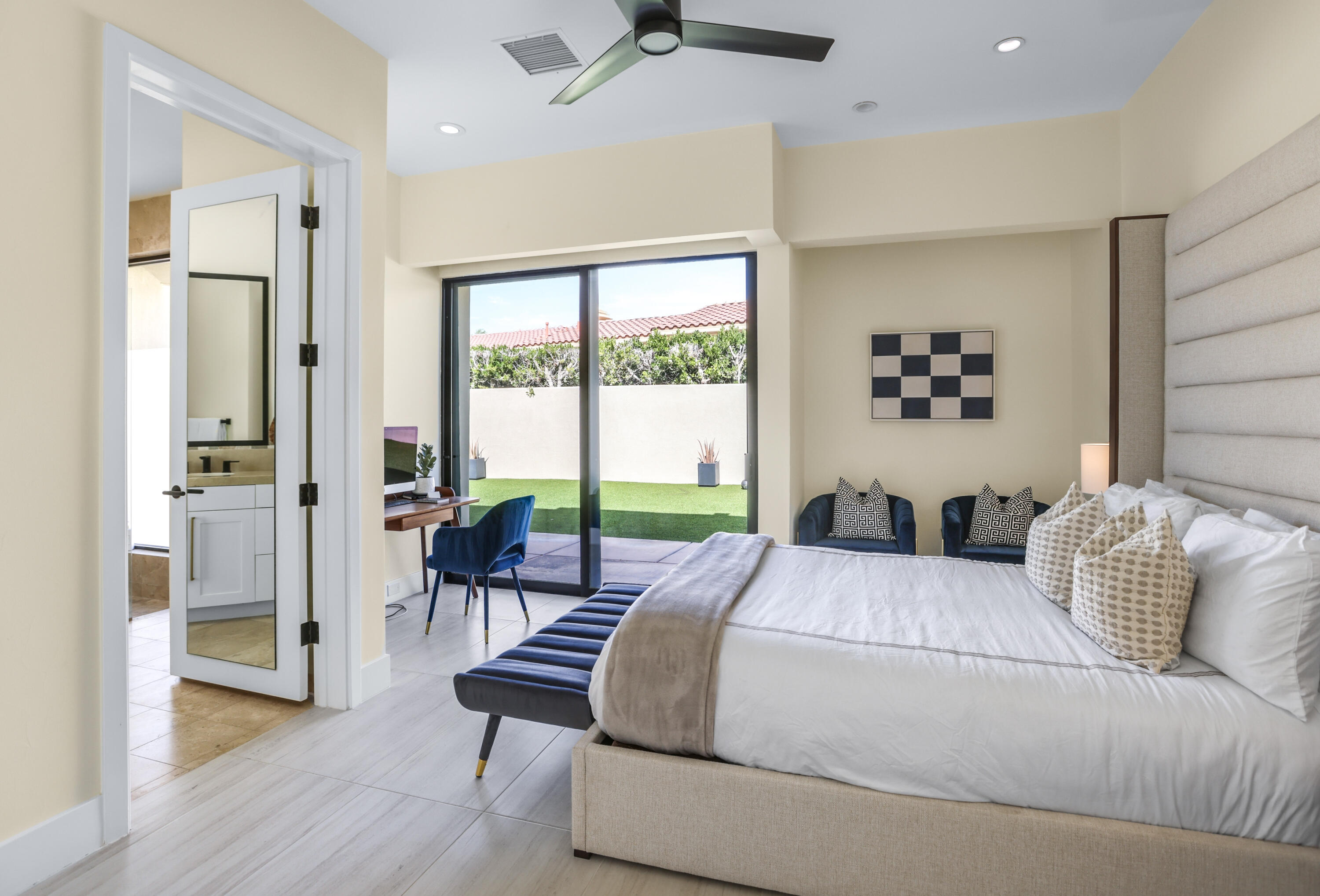 1 Seclude Court Rancho Mirage, CA 92270 - Photo 36 of 52 a bedroom with a bed and a couch