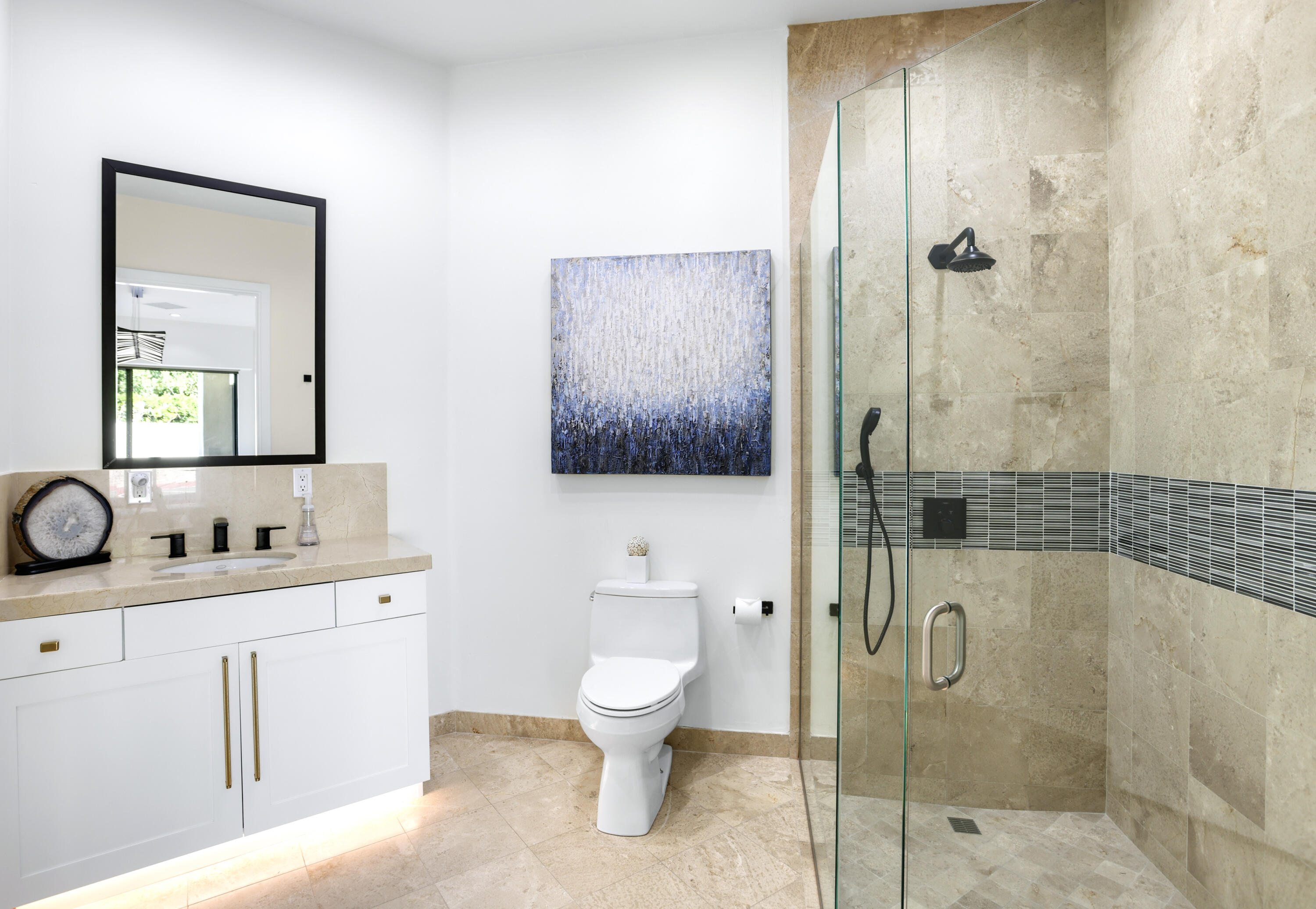 1 Seclude Court Rancho Mirage, CA 92270 - Photo 40 of 52 a bathroom with a toilet sink shower and mirror