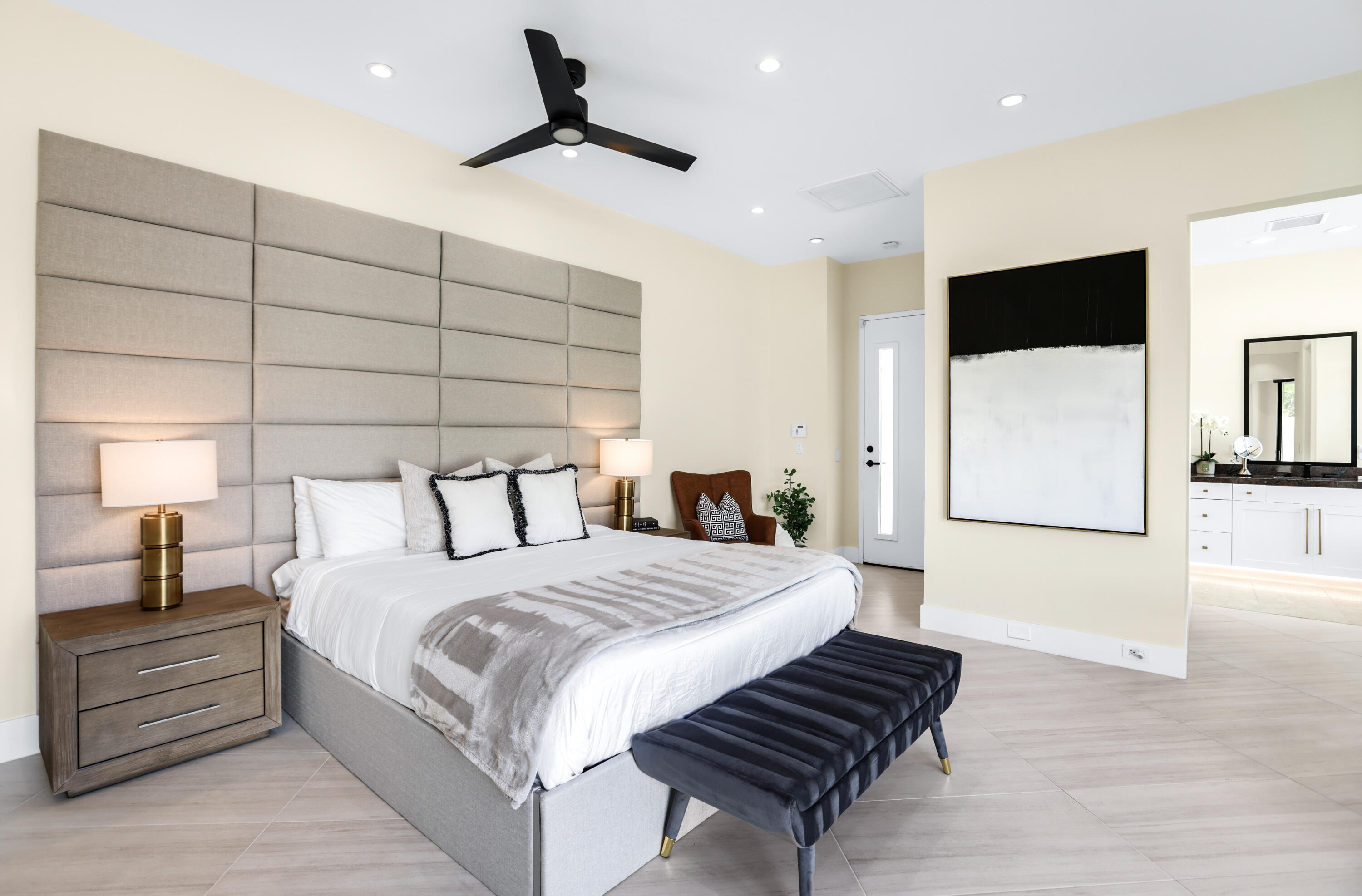 1 Seclude Court Rancho Mirage, CA 92270 - Photo 41 of 52 a bedroom with a large bed and a chandelier