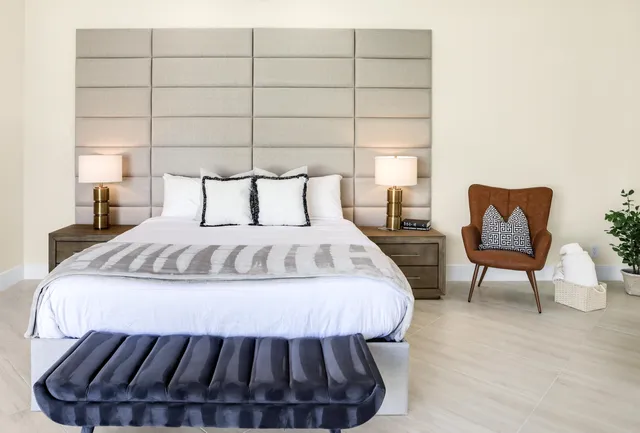 a bathroom with double sink and a mirror