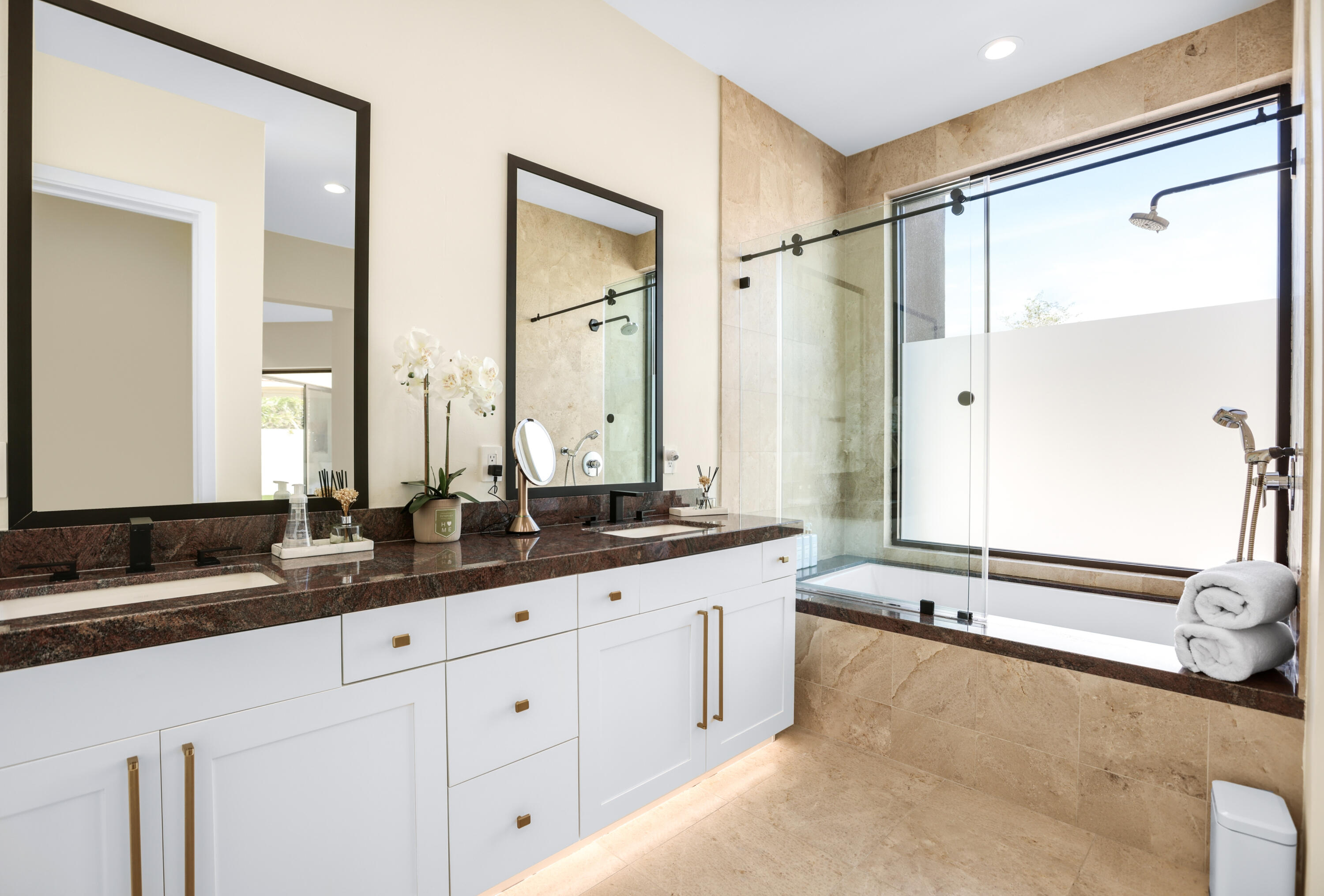 1 Seclude Court Rancho Mirage, CA 92270 - Photo 44 of 52 a bathroom with double sink and a mirror
