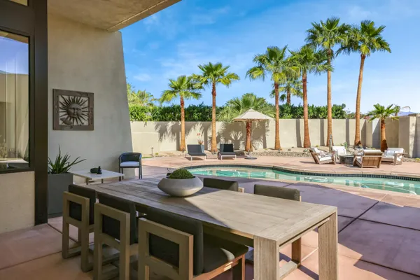 a view of swimming pool having outdoor seating