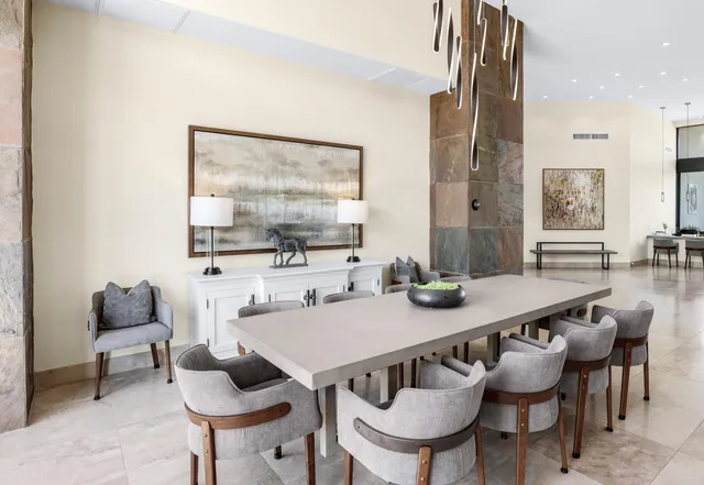 a dining room with furniture and wooden floor