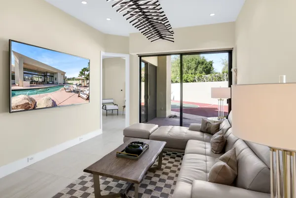 a living room with furniture and a window