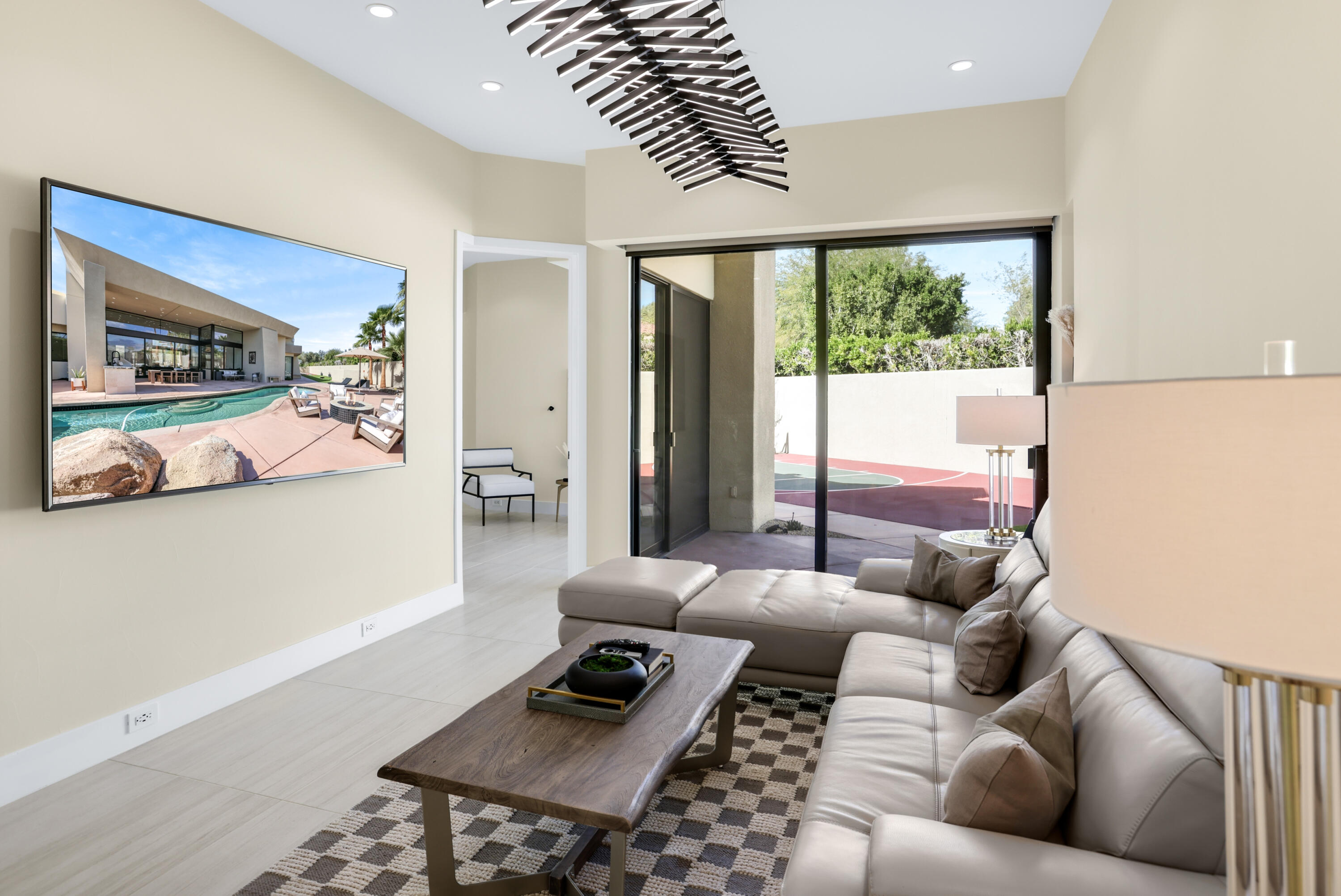 1 Seclude Court Rancho Mirage, CA 92270 - Photo 7 of 52 a living room with furniture and a window