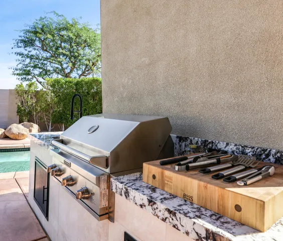 a stove top oven sitting inside of a kitchen