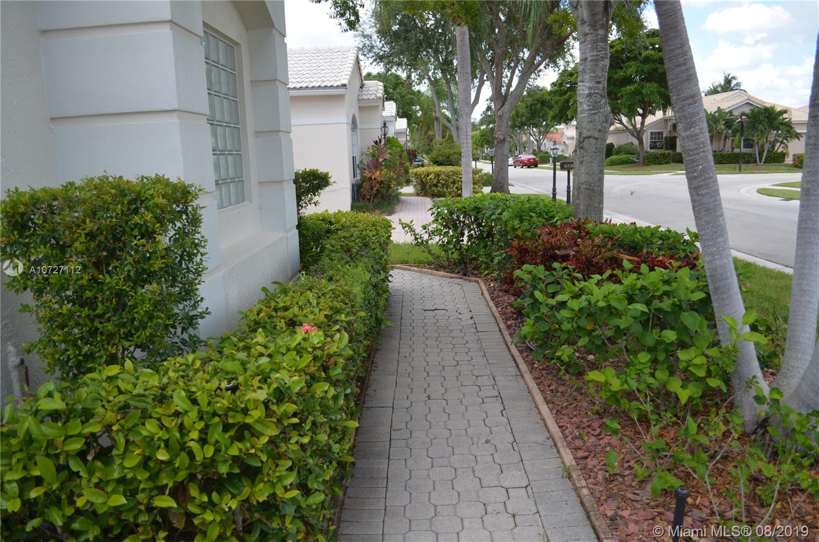 6334 Brava Way Boca Raton, FL 33433 - Photo 20 of 41 WALKWAY TO COVERED FRONT PORCH
