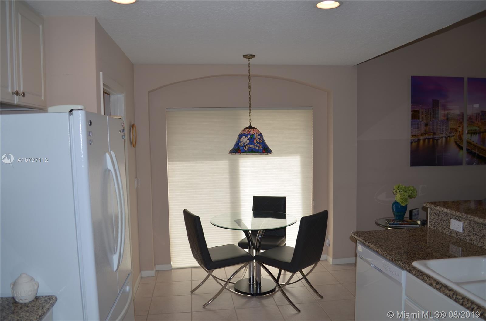 6334 Brava Way Boca Raton, FL 33433 - Photo 26 of 41 PERFECT BREAKFAST NOOK WITH SLIDING DOOR TO ONE OF THE PATIOS
