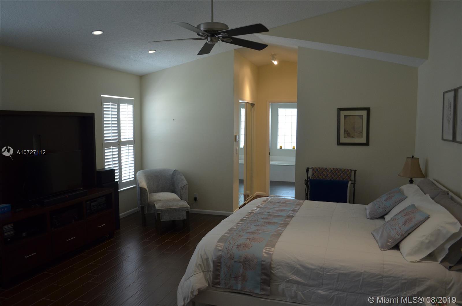 6334 Brava Way Boca Raton, FL 33433 - Photo 28 of 41 HUGE MASTER BEDROOM, WITH TWO WALK IN CLOSETS ON THE FIRST FLOOR.