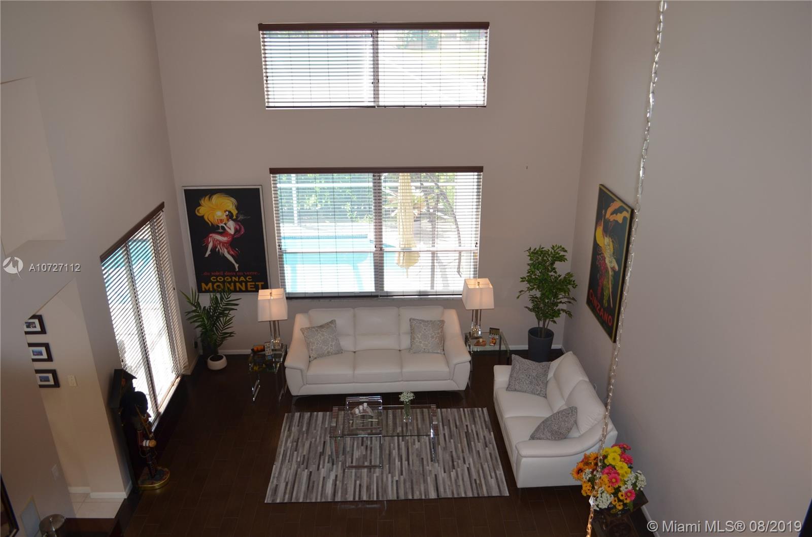 6334 Brava Way Boca Raton, FL 33433 - Photo 32 of 41 VIEW OF FAMILY ROOM FROM UPSTAIRS DEN; NOTICE THE AMOUNT OF NATURAL LIGHT
