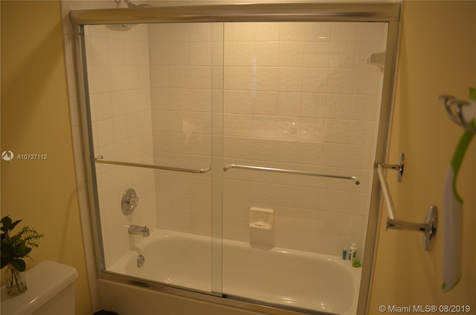 6334 Brava Way Boca Raton, FL 33433 - Photo 35 of 41 PRISTINE SHOWER/TUB IN JACK AND JILL BATHROOM