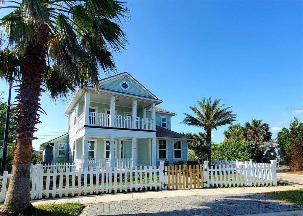37 Sandy Beach Way Palm Coast, FL 32137 - Photo 1 of 1 a front view of a house with a garden