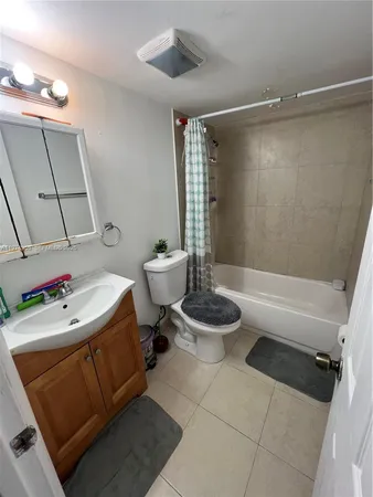 an empty room with closet and wooden door