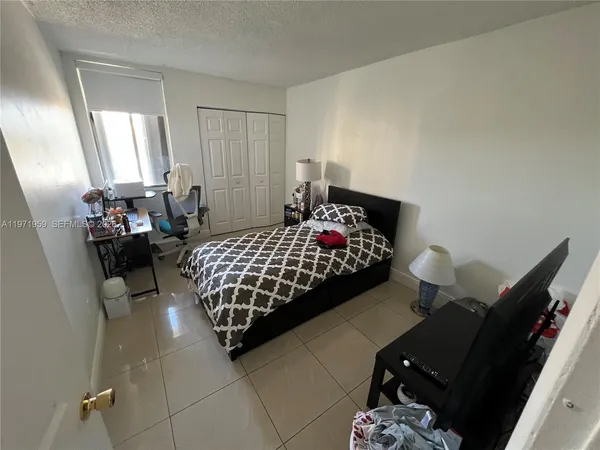 a kitchen with a refrigerator sink and microwave