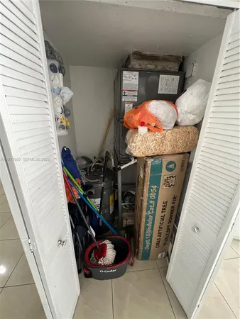 a kitchen with a sink appliances and cabinets