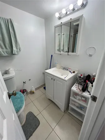 a bathroom with sink and toilet