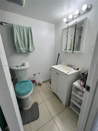 a bedroom with furniture and a flat screen tv