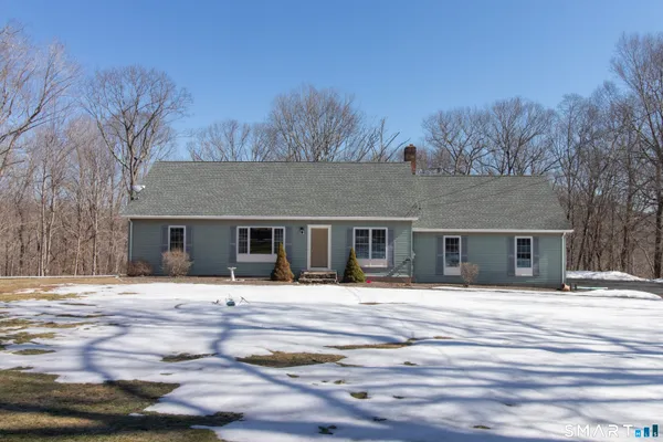 a house with trees in the background