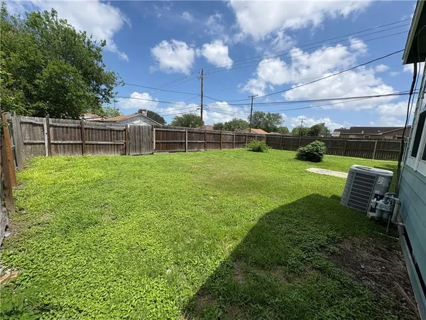 a view of a backyard with sitting area