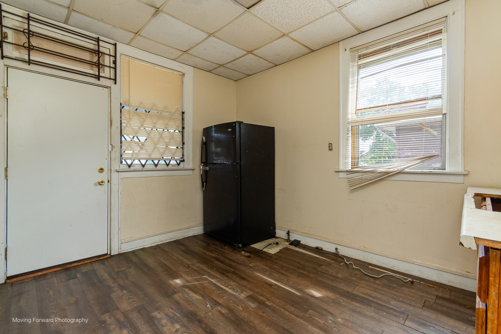 8153 South Sangamon Street Chicago, IL 60620 - Photo 15 of 37 a view of an empty room with wooden floor and a window