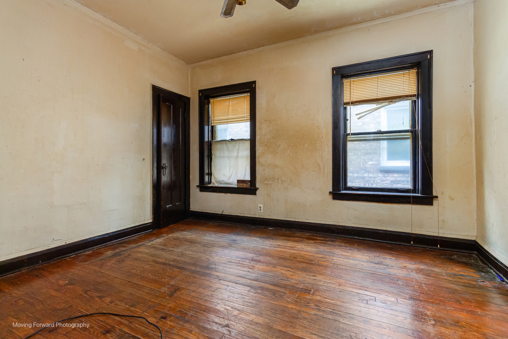 8153 South Sangamon Street Chicago, IL 60620 - Photo 18 of 37 an empty room with wooden floor and windows