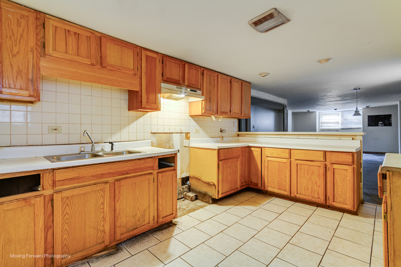 8153 South Sangamon Street Chicago, IL 60620 - Photo 26 of 37 a kitchen with sink cabinets and window
