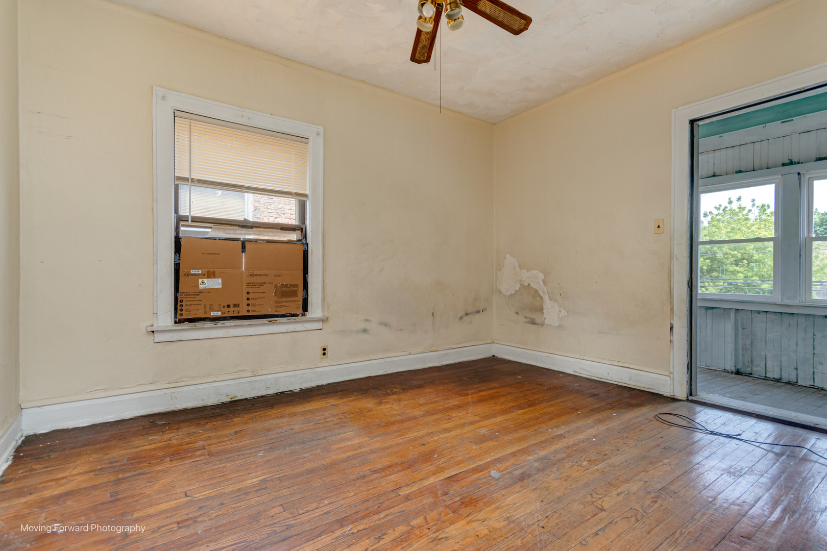 8153 South Sangamon Street Chicago, IL 60620 - Photo 32 of 37 an empty room with wooden floor cabinet and windows