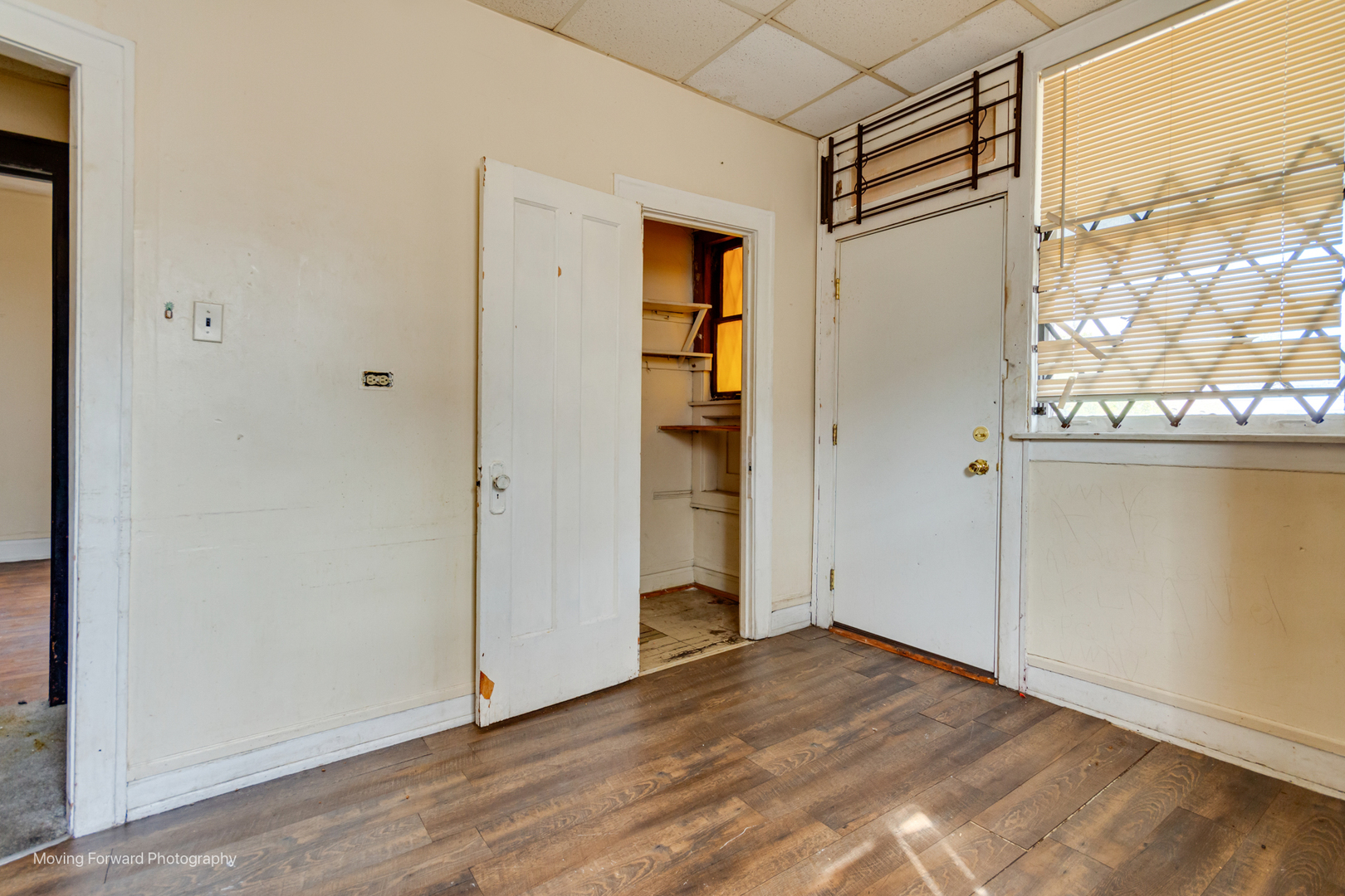 8153 South Sangamon Street Chicago, IL 60620 - Photo 34 of 37 a view of empty room with wooden floor and cabinet