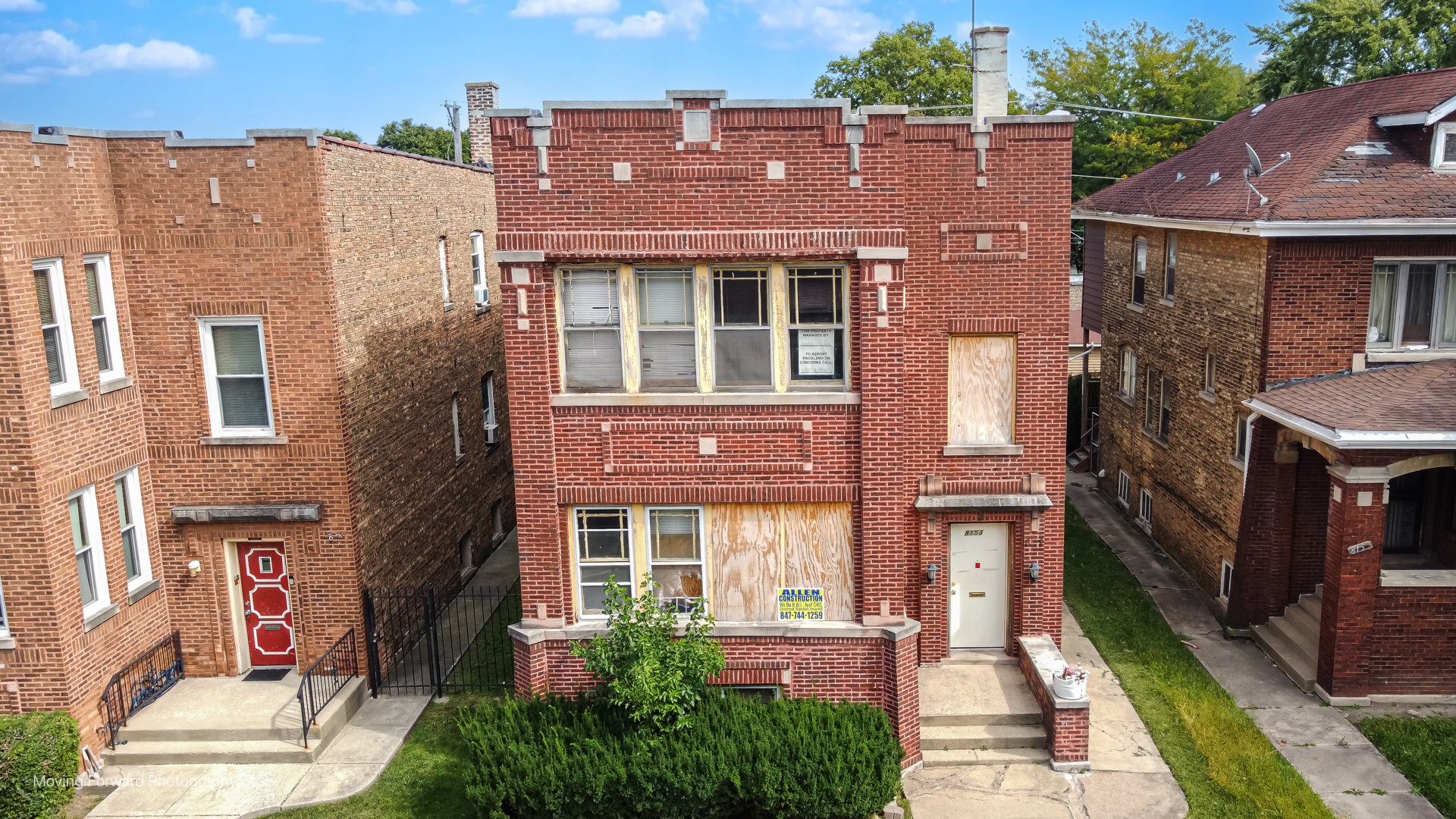 8153 South Sangamon Street Chicago, IL 60620 - Photo 6 of 37 aerial view of a brick building next to a yard