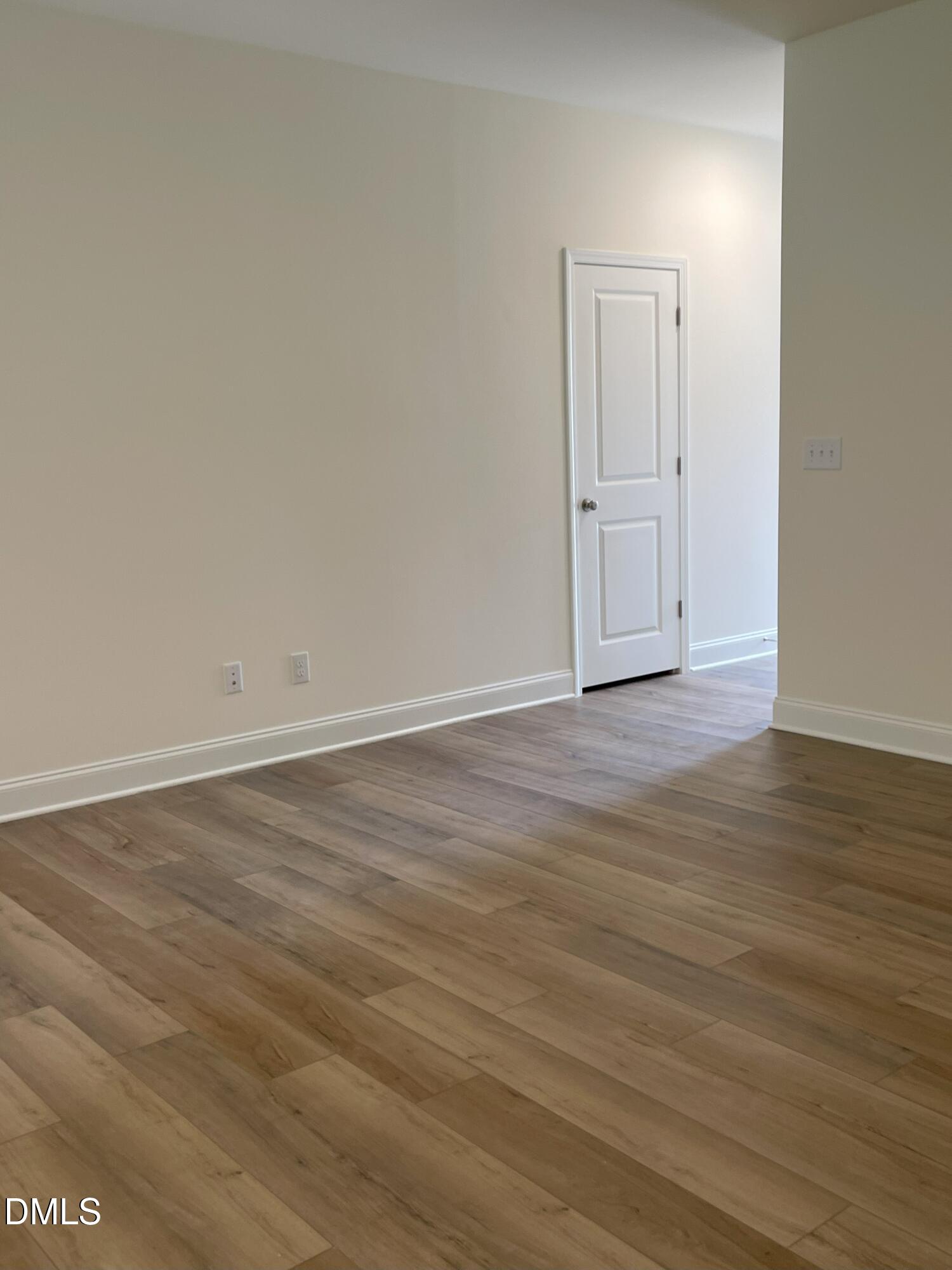 6404 Lady Eliza Lane Raleigh, NC 27610 - Photo 11 of 37 a view of an empty room with wooden floor