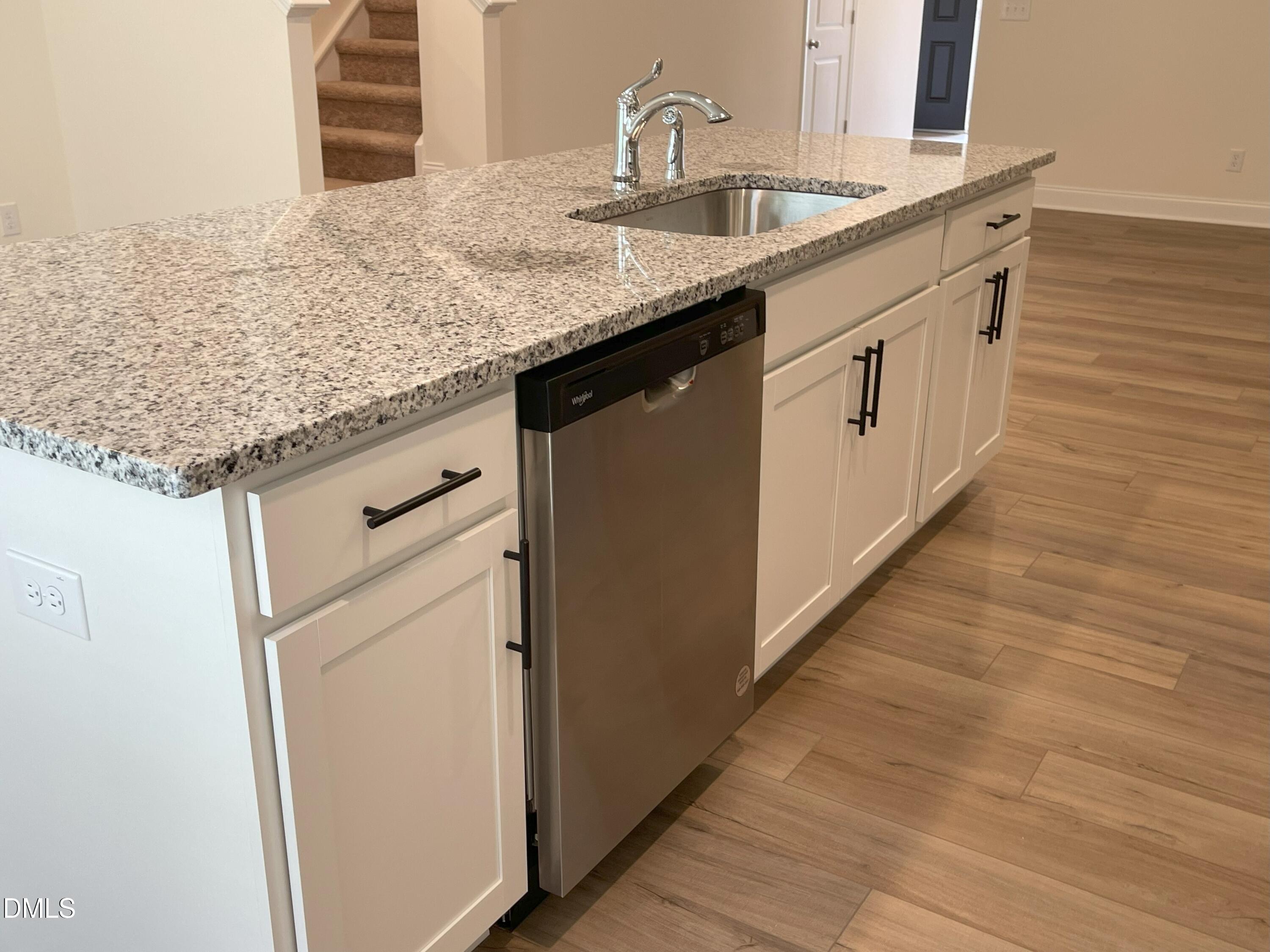 6404 Lady Eliza Lane Raleigh, NC 27610 - Photo 14 of 37 a utility room with granite countertop cabinets and sink