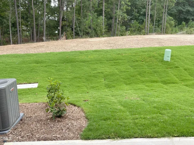 a kitchen with a sink and a wooden floor
