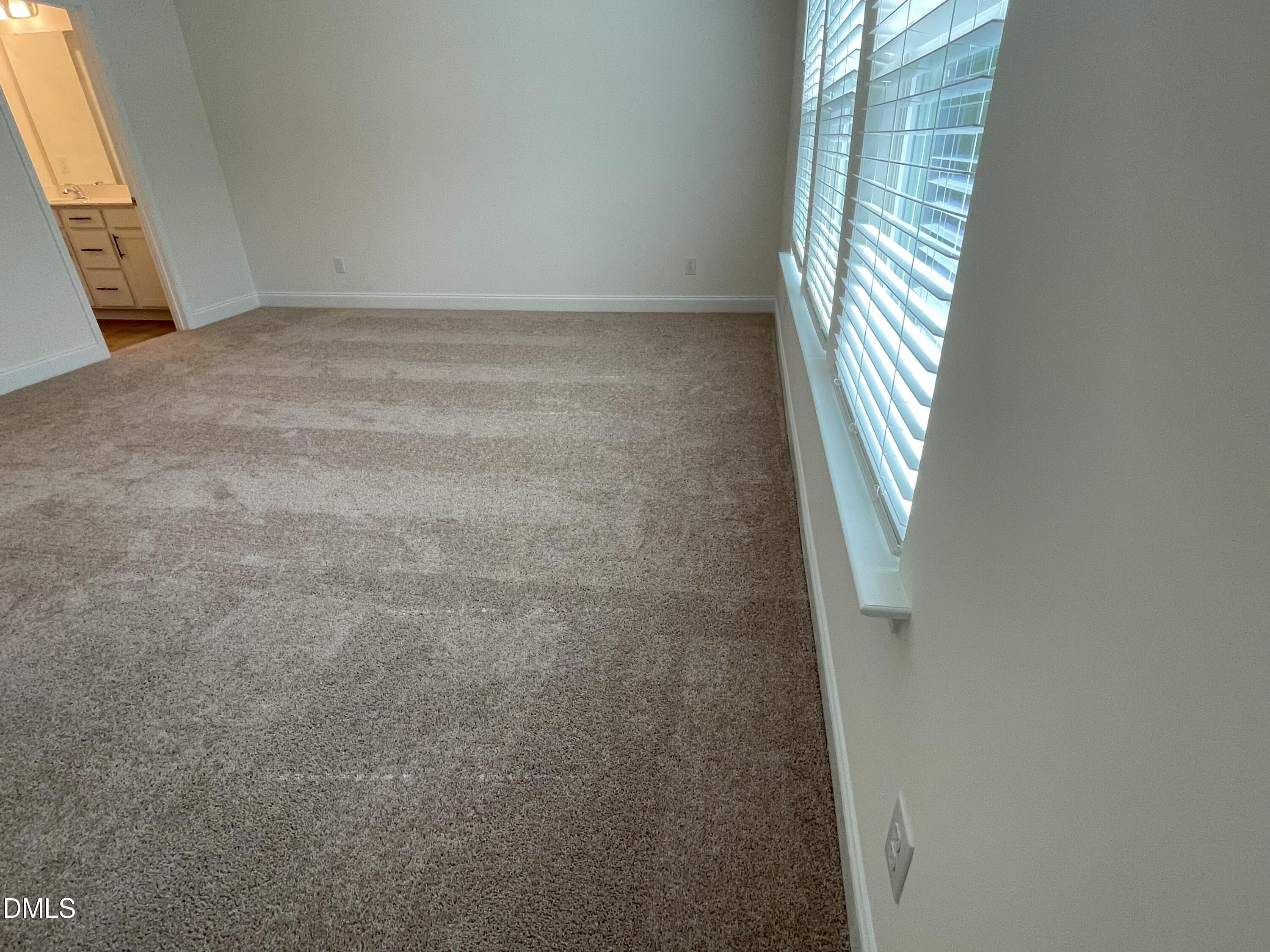 6404 Lady Eliza Lane Raleigh, NC 27610 - Photo 21 of 37 a view of an empty room with windows