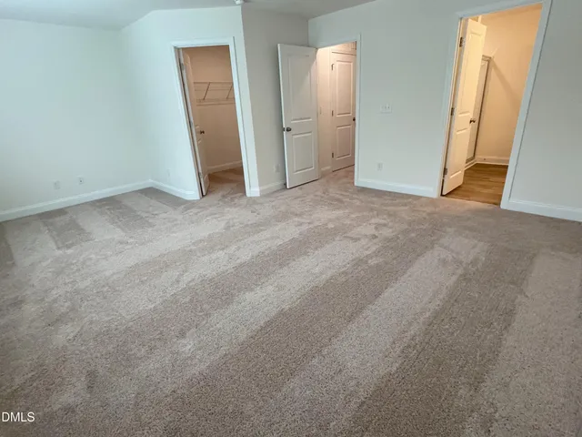 an empty room with closet area