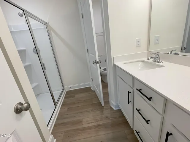 a bathroom with sink and mirror