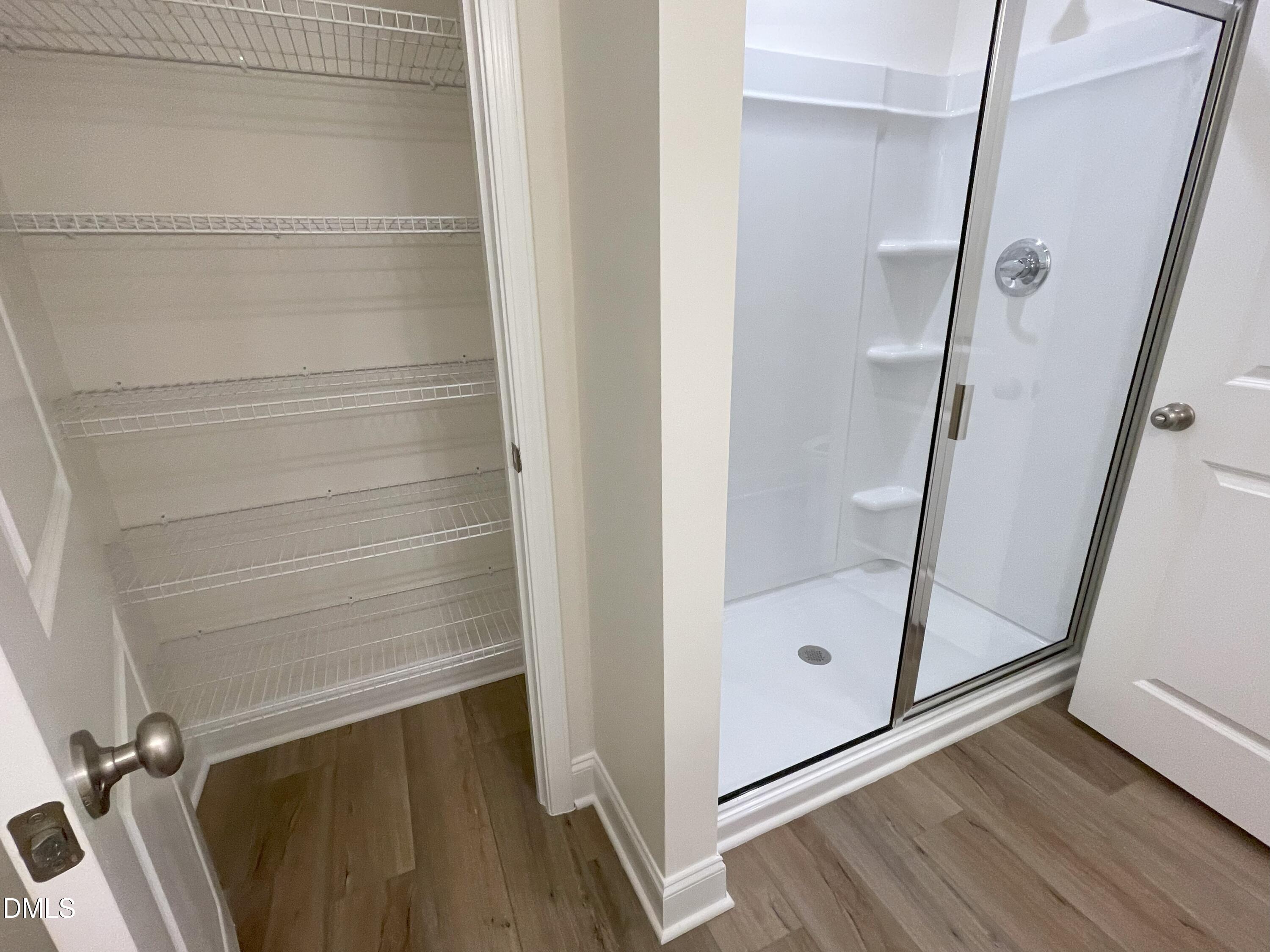 6404 Lady Eliza Lane Raleigh, NC 27610 - Photo 27 of 37 a bathroom with a glass door shower