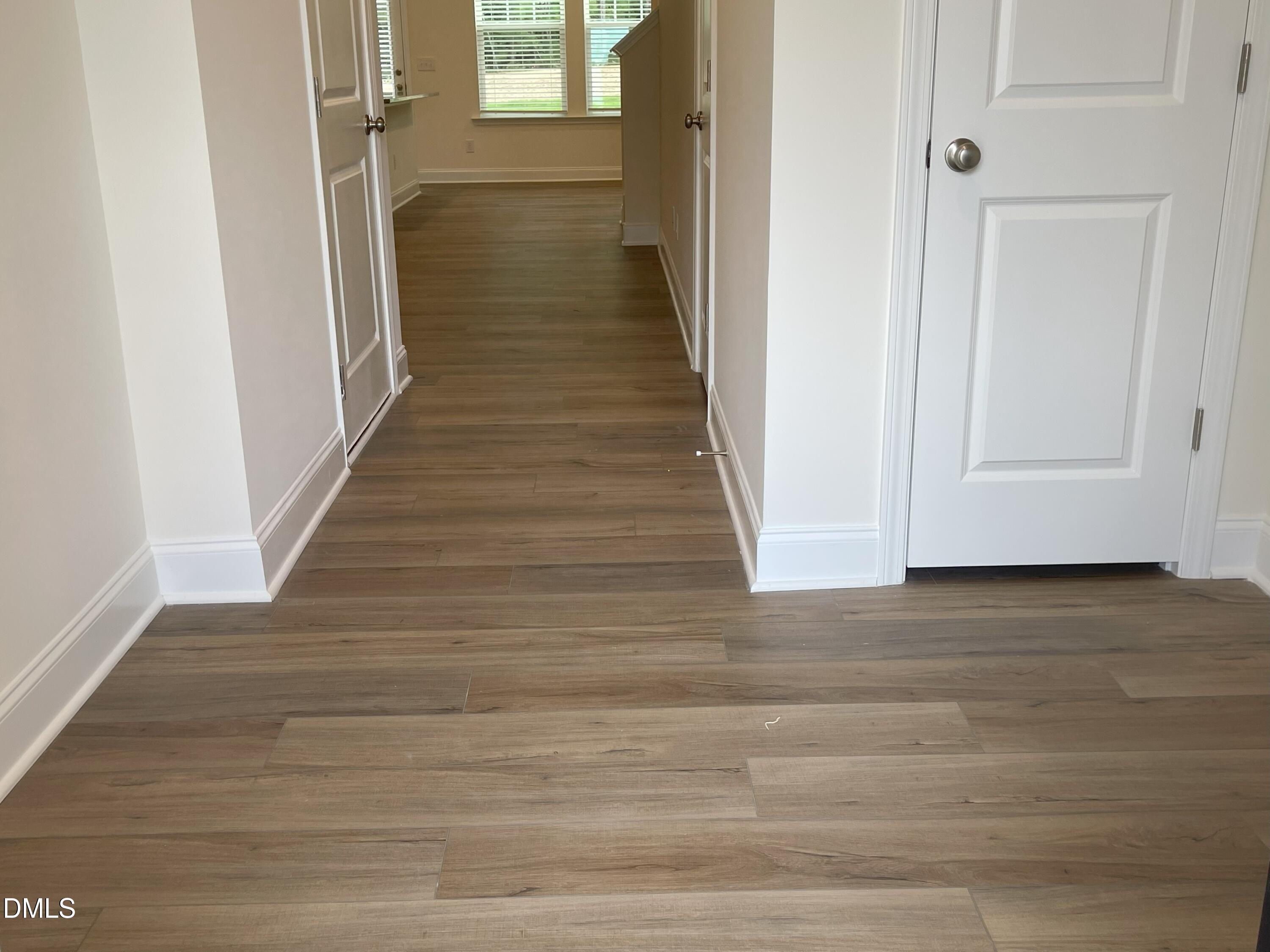 6404 Lady Eliza Lane Raleigh, NC 27610 - Photo 4 of 37 a view of a hallway with wooden floor and staircase