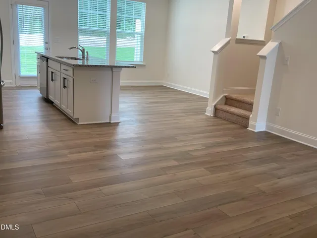 a view of a kitchen cabinets a sink and dishwasher in a room