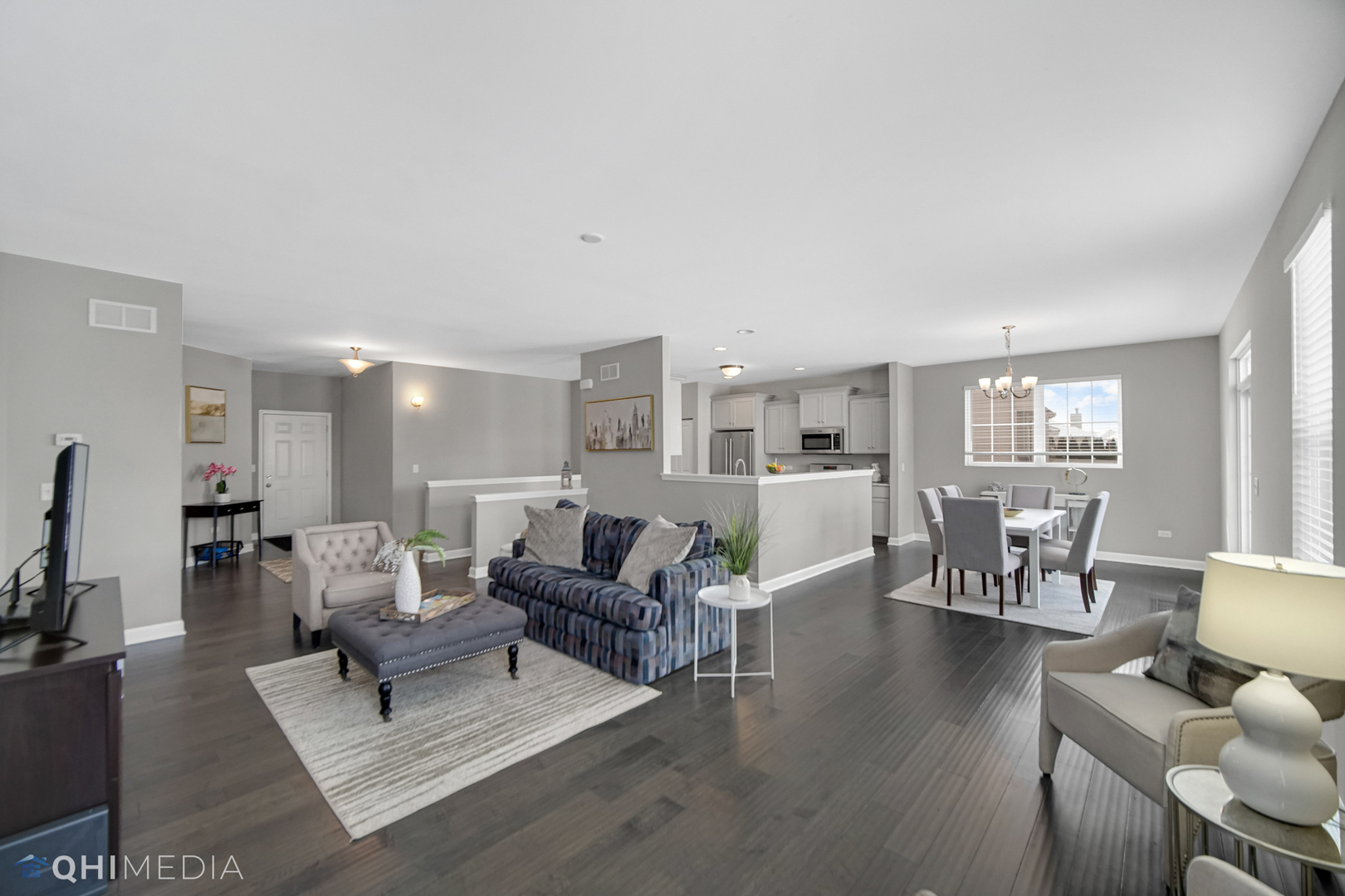 16432 Mueller Circle Plainfield, IL 60586 - Photo 11 of 22 a living room with furniture wooden floor and a flat screen tv