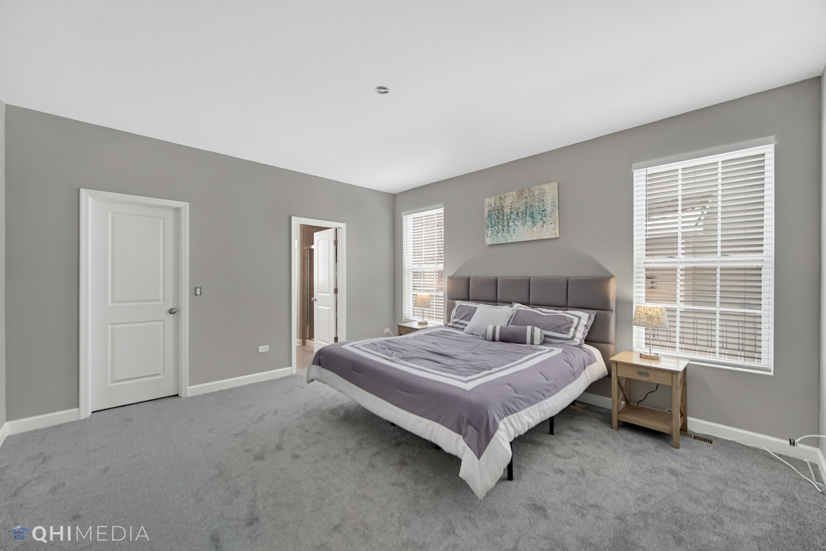 16432 Mueller Circle Plainfield, IL 60586 - Photo 14 of 22 a bed sitting in a spacious bedroom next to a window and dresser