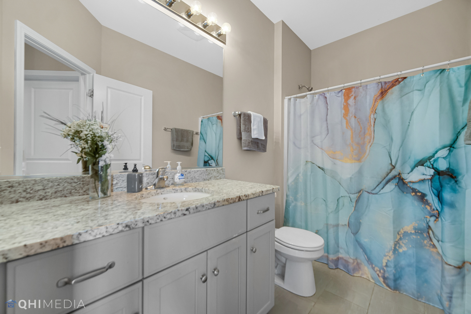 16432 Mueller Circle Plainfield, IL 60586 - Photo 17 of 22 a bathroom with a granite countertop sink toilet and shower