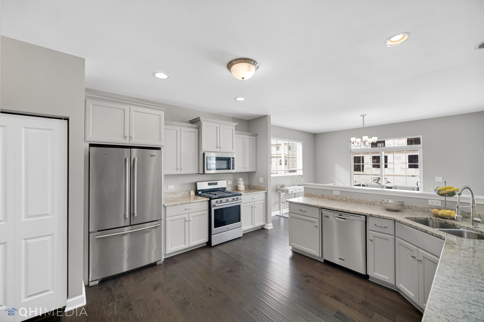 16432 Mueller Circle Plainfield, IL 60586 - Photo 3 of 22 a kitchen with a sink stainless steel appliances and window