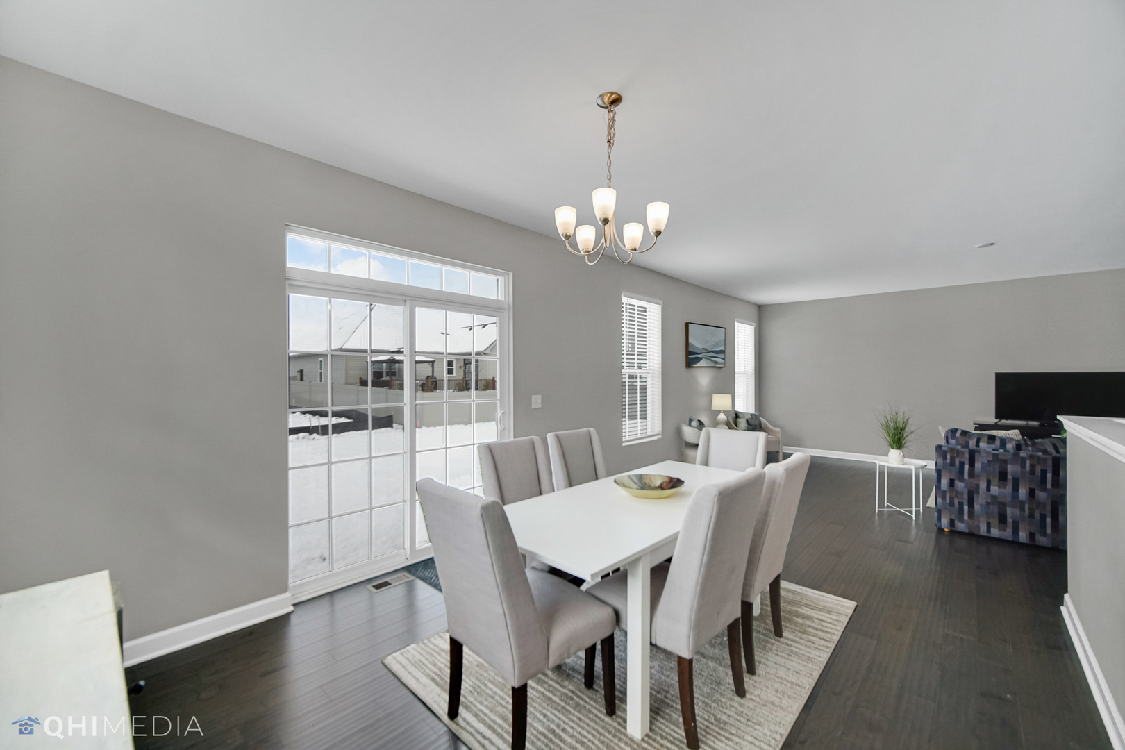 16432 Mueller Circle Plainfield, IL 60586 - Photo 7 of 22 a view of a dining room with furniture wooden floor and chandelier