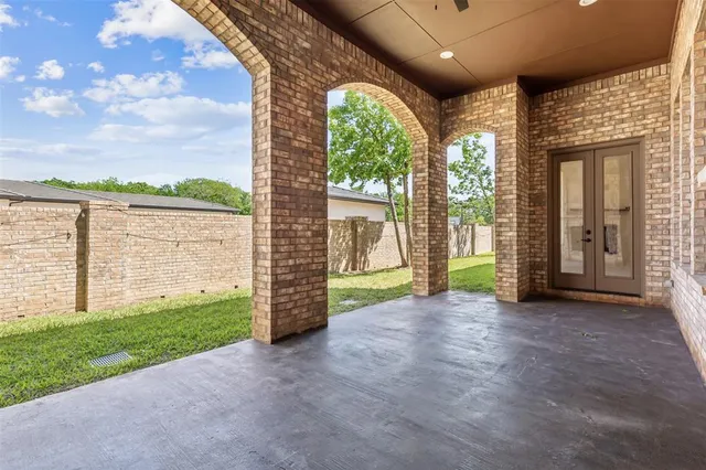 a view of a garden with an outdoor seating