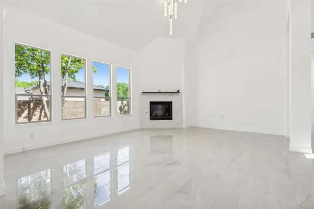 a view of an empty room with windows