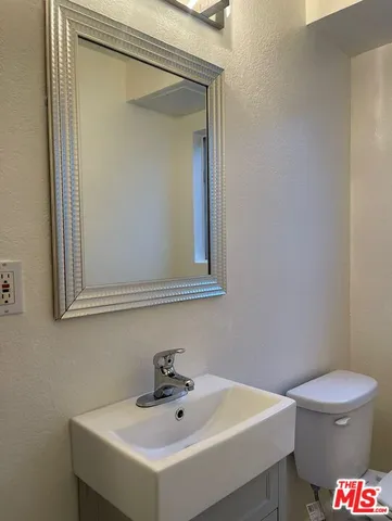 a bathroom with a sink and a toilet