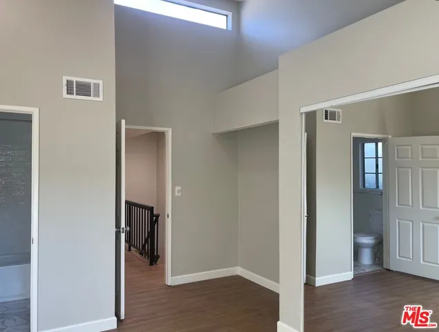 a view of hallway with wooden floor