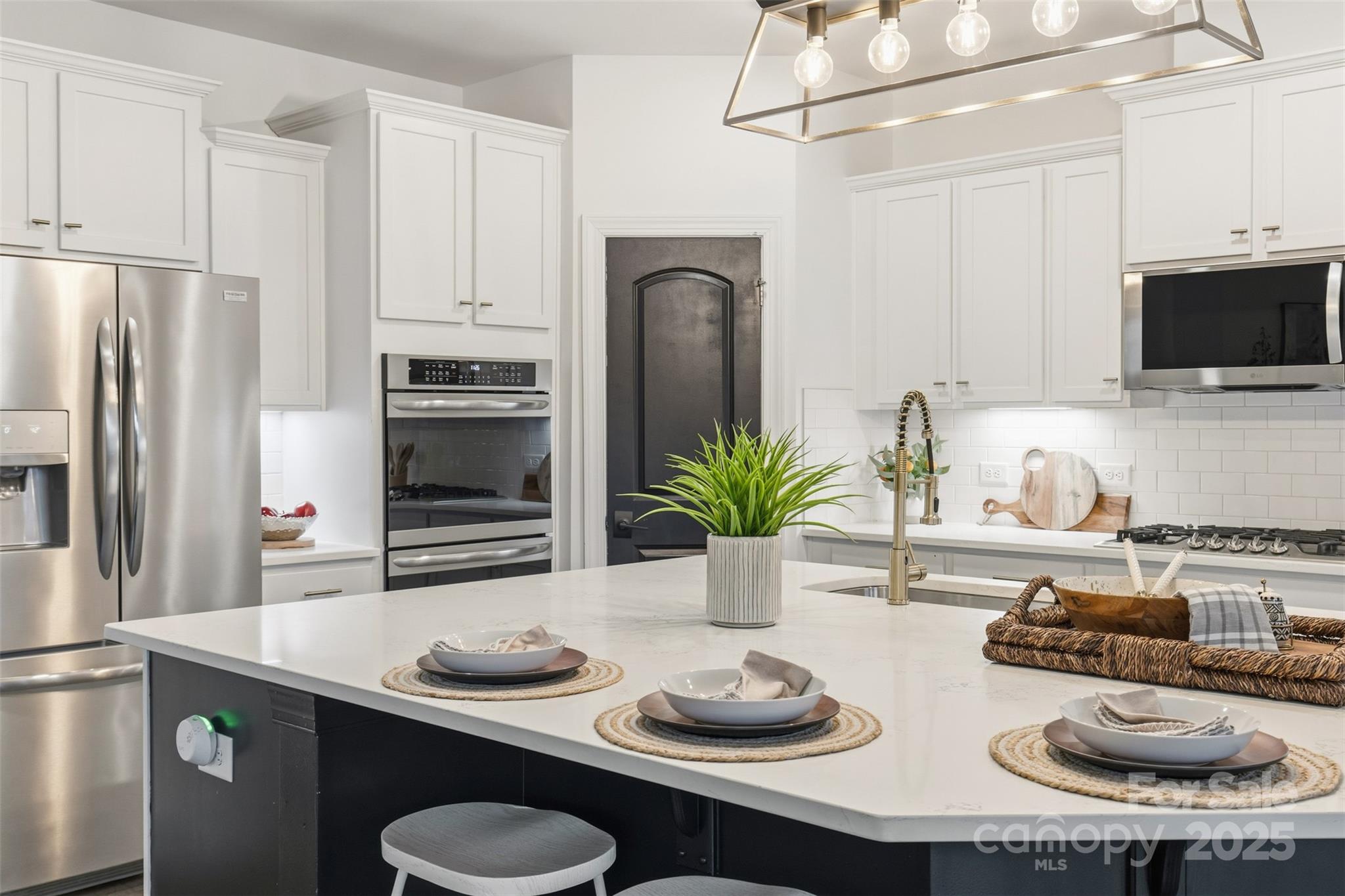 16714 Setter Point Lane Davidson, NC 28036 - Photo 11 of 29 a kitchen with sink and refrigerator